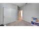 Bright bedroom with carpeted floors and plenty of storage in closet, plus book shelf at 11402 Ethereal Landing Ave, Las Vegas, NV 89138