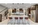 Contemporary kitchen boasts a large island with seating and stainless steel appliances at 11402 Ethereal Landing Ave, Las Vegas, NV 89138