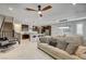 Spacious living area with an open layout connecting the kitchen, dining area, and staircase at 11402 Ethereal Landing Ave, Las Vegas, NV 89138