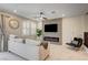Cozy living room with a modern fireplace, neutral tones, and plantation shutters for natural light at 11402 Ethereal Landing Ave, Las Vegas, NV 89138