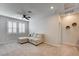 Large living room featuring a comfortable sectional sofa, ceiling fan and shutters at 11402 Ethereal Landing Ave, Las Vegas, NV 89138