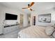 Spacious main bedroom featuring a TV, and access to a large bathroom and walk-in closet at 11402 Ethereal Landing Ave, Las Vegas, NV 89138