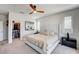 Bright bedroom featuring a walk-in closet, white paneling, and comfortable furnishings at 11402 Ethereal Landing Ave, Las Vegas, NV 89138