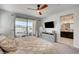 Large main bedroom with balcony access and modern furnishings at 11402 Ethereal Landing Ave, Las Vegas, NV 89138