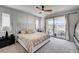Spacious main bedroom with modern furnishings and balcony access at 11402 Ethereal Landing Ave, Las Vegas, NV 89138
