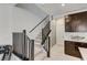 Carpeted staircase with modern dark wood railings at 11402 Ethereal Landing Ave, Las Vegas, NV 89138