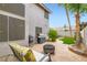 Relaxing backyard seating area, BBQ grill, and cozy fire pit for outdoor living at 1325 Baychester Dr, Henderson, NV 89002