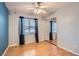 Bedroom with hardwood floors, closet with mirrored doors, and a large window at 1325 Baychester Dr, Henderson, NV 89002