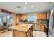 Modern kitchen with stainless steel appliances and a granite-topped island at 1325 Baychester Dr, Henderson, NV 89002