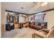 Living room with a ceiling fan, a large window, and a comfortable recliner at 1325 Baychester Dr, Henderson, NV 89002