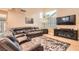Cozy living room with comfortable seating and a modern fireplace at 1325 Baychester Dr, Henderson, NV 89002