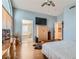 Large main bedroom leads to a bathroom with a tub and features laminate wood flooring at 1325 Baychester Dr, Henderson, NV 89002