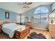 Spacious main bedroom with a large window and a wood accent chest at 1325 Baychester Dr, Henderson, NV 89002