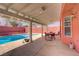 Inviting backyard with a covered patio, outdoor furniture, and a sparkling swimming pool at 1428 Daybreak Dr, Las Vegas, NV 89108