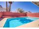 Inviting backyard featuring a refreshing swimming pool and surrounded by lush greenery at 1428 Daybreak Dr, Las Vegas, NV 89108
