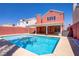 Private backyard featuring a refreshing swimming pool and a spacious covered patio area at 1428 Daybreak Dr, Las Vegas, NV 89108