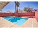Backyard with a clear blue pool, surrounded by lush landscaping, perfect for relaxing outdoors at 1428 Daybreak Dr, Las Vegas, NV 89108