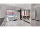 Eat-in kitchen with stainless steel appliances, tile flooring, and sliding glass doors to private pool at 1428 Daybreak Dr, Las Vegas, NV 89108