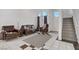 This light and airy living room features a fireplace, tile flooring, and a staircase to the upper level at 1428 Daybreak Dr, Las Vegas, NV 89108