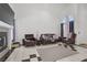 This light and airy living room features a fireplace, tile flooring, and an arched window at 1428 Daybreak Dr, Las Vegas, NV 89108