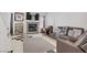The light and airy living room showcases a decorative fireplace and tile flooring at 1428 Daybreak Dr, Las Vegas, NV 89108