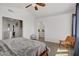 Spacious primary bedroom with vaulted ceiling, wood flooring and a cozy chair at 1428 Daybreak Dr, Las Vegas, NV 89108