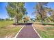 Walking path at a park with trees and picnic areas surrounding at 1428 Daybreak Dr, Las Vegas, NV 89108