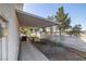Side yard with landscaping and an A/C unit at 170 Dove St, Pahrump, NV 89060