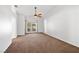 Spacious bedroom with a ceiling fan and sliding glass doors to the backyard at 170 Dove St, Pahrump, NV 89060