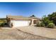 Charming single-story home featuring a wide driveway, two-car garage, and well-maintained front yard at 170 Dove St, Pahrump, NV 89060