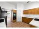 Well-equipped kitchen featuring wood cabinetry, solid surface counters, and modern appliances at 170 Dove St, Pahrump, NV 89060