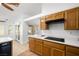 Traditional kitchen featuring light wood cabinetry and a smooth cooktop at 170 Dove St, Pahrump, NV 89060
