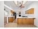 Bright kitchen with light wood cabinets, solid surface countertops, and modern appliances at 170 Dove St, Pahrump, NV 89060