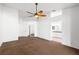Large primary bedroom featuring a ceiling fan, carpet, and en-suite bathroom at 170 Dove St, Pahrump, NV 89060