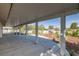 Covered patio and landscaping in backyard at 170 Dove St, Pahrump, NV 89060