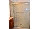 Bathroom shower features tile walls, glass sliding doors, and metal shower head at 1830 N Buffalo Dr # 1010, Las Vegas, NV 89128