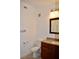 Bathroom with toilet and vanity with wood cabinetry, granite countertop at 1830 N Buffalo Dr # 1010, Las Vegas, NV 89128