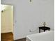Bedroom with a simple headboard, small lamp, and minimal decor at 1830 N Buffalo Dr # 1010, Las Vegas, NV 89128
