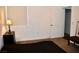 Bedroom with carpet and empty bed frame next to window and furniture at 1830 N Buffalo Dr # 1010, Las Vegas, NV 89128