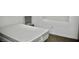 A modest bedroom featuring carpet flooring, simple walls, and a bed at 1830 N Buffalo Dr # 1010, Las Vegas, NV 89128