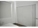 Compact bedroom with window, closet with sliding doors, and neutral decor at 1830 N Buffalo Dr # 1010, Las Vegas, NV 89128