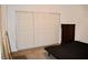 Bedroom with carpet and empty bed frame, large closet with doors at 1830 N Buffalo Dr # 1010, Las Vegas, NV 89128