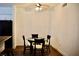View of the dining area featuring a round table with chairs and a ceiling fan at 1830 N Buffalo Dr # 1010, Las Vegas, NV 89128