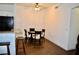 Dining area with round glass table and views into kitchen at 1830 N Buffalo Dr # 1010, Las Vegas, NV 89128