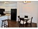 View of the kitchen and the dining area with table and chairs at 1830 N Buffalo Dr # 1010, Las Vegas, NV 89128