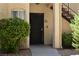 Inviting front door with decorative security screen and well-maintained landscaping at 1830 N Buffalo Dr # 1010, Las Vegas, NV 89128