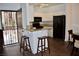 Kitchen view features a black appliance package, granite countertops, and eat-in bar at 1830 N Buffalo Dr # 1010, Las Vegas, NV 89128