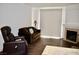 Bright living room with hardwood floors, a cozy fireplace, and neutral decor at 1830 N Buffalo Dr # 1010, Las Vegas, NV 89128