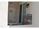Enclosed patio area with outdoor lighting, furniture, and a door at 1830 N Buffalo Dr # 1010, Las Vegas, NV 89128