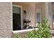 Inviting patio with an outdoor light, a dining table, and decorative greenery at 1830 N Buffalo Dr # 1010, Las Vegas, NV 89128